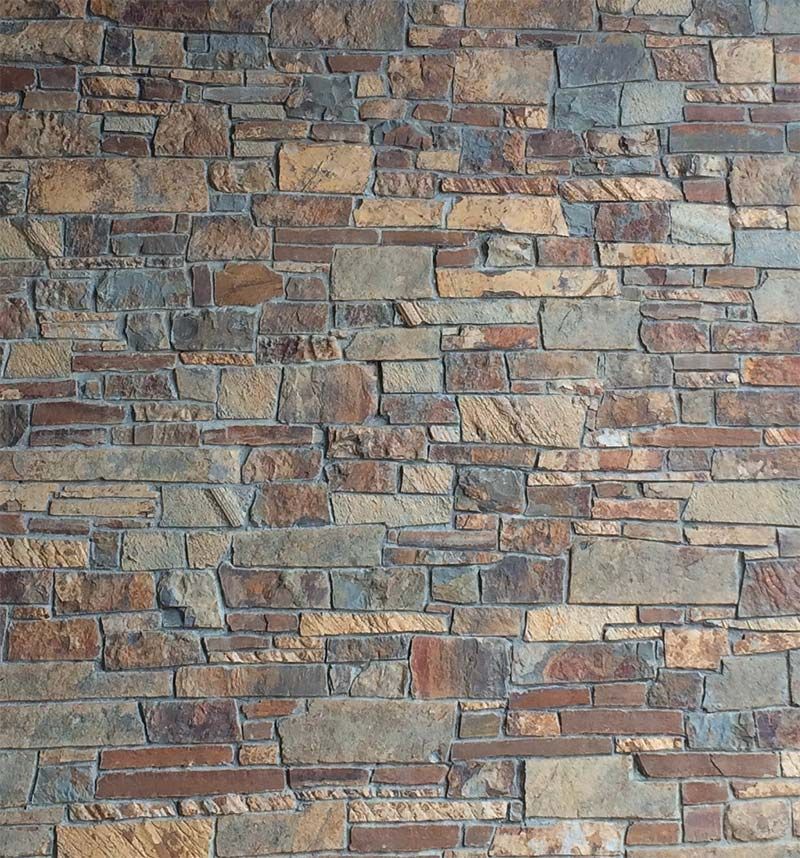 A brick wall with a lot of different bricks on it