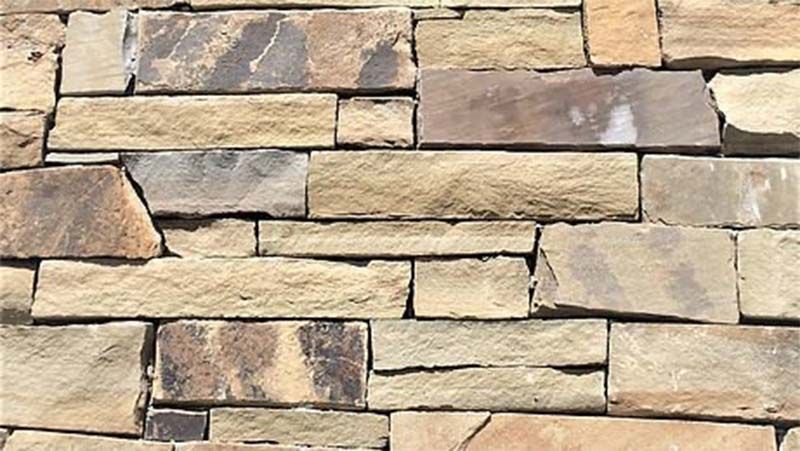 A close up of a stone wall with a lot of bricks