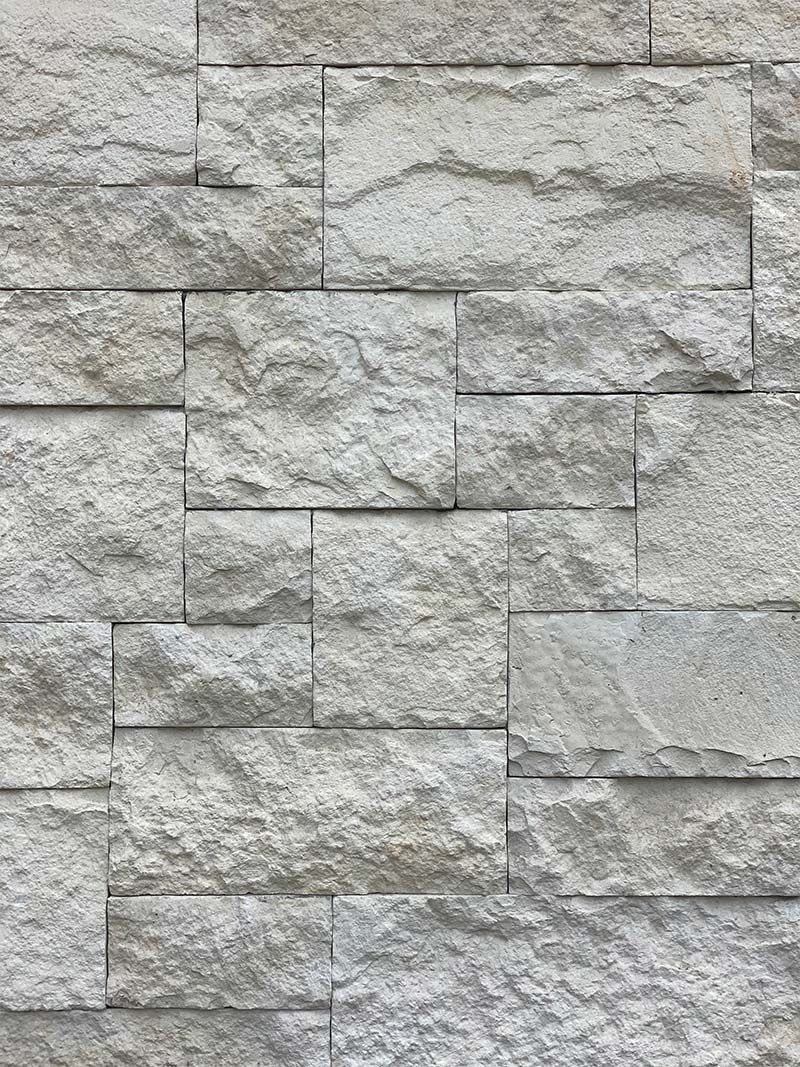 A close up of a white brick wall.
