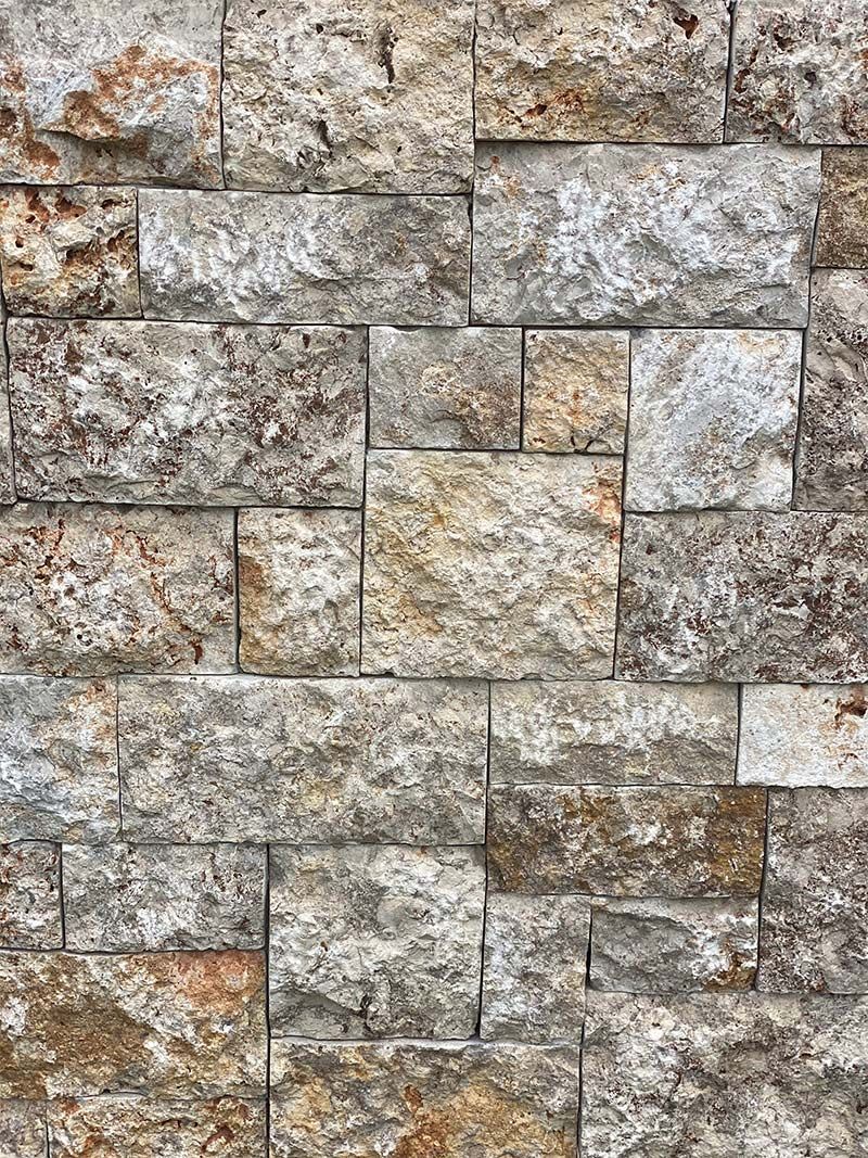 A close up of a stone wall made of bricks.