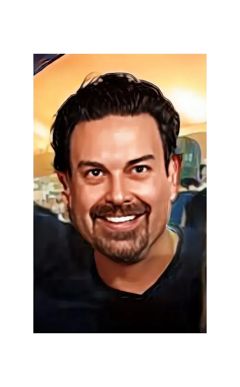 Picture of Erik Fleming with a mustache and beard smiling for the camera
