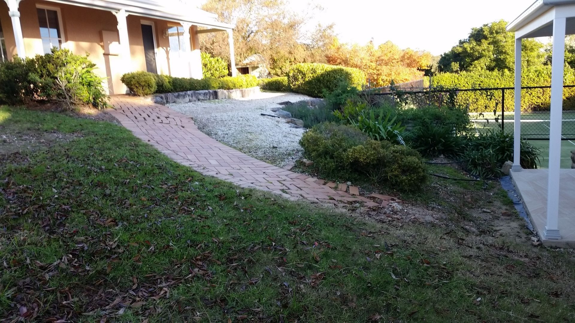 Brick Pathway Curves Through a Grassy Area — Total Perfection In Erina, NSW