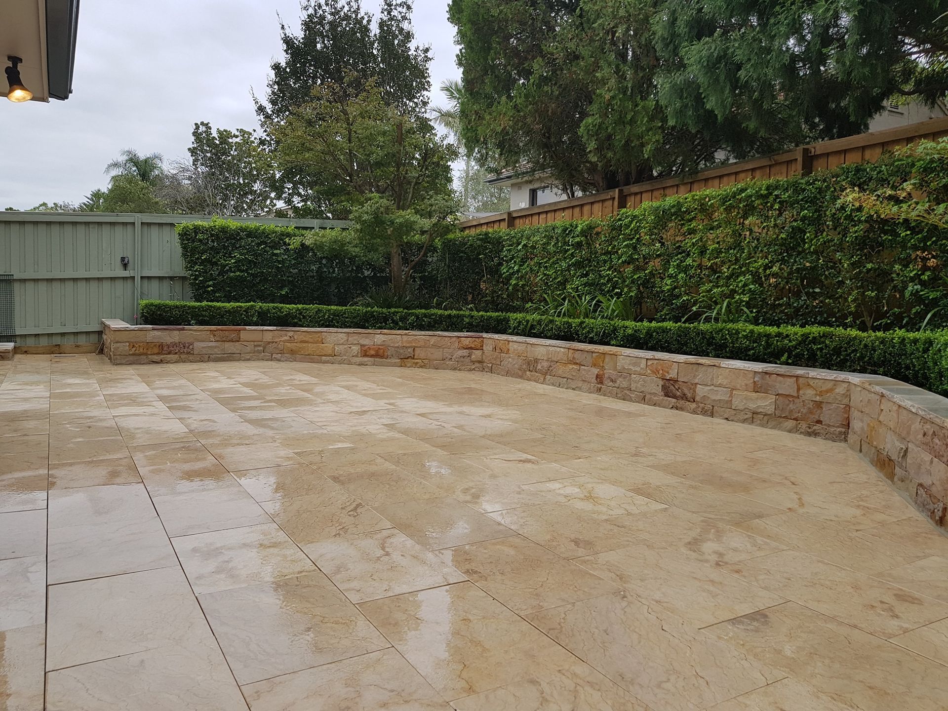 A Patio With Sandstone Pavers — Total Perfection In Kariong, NSW