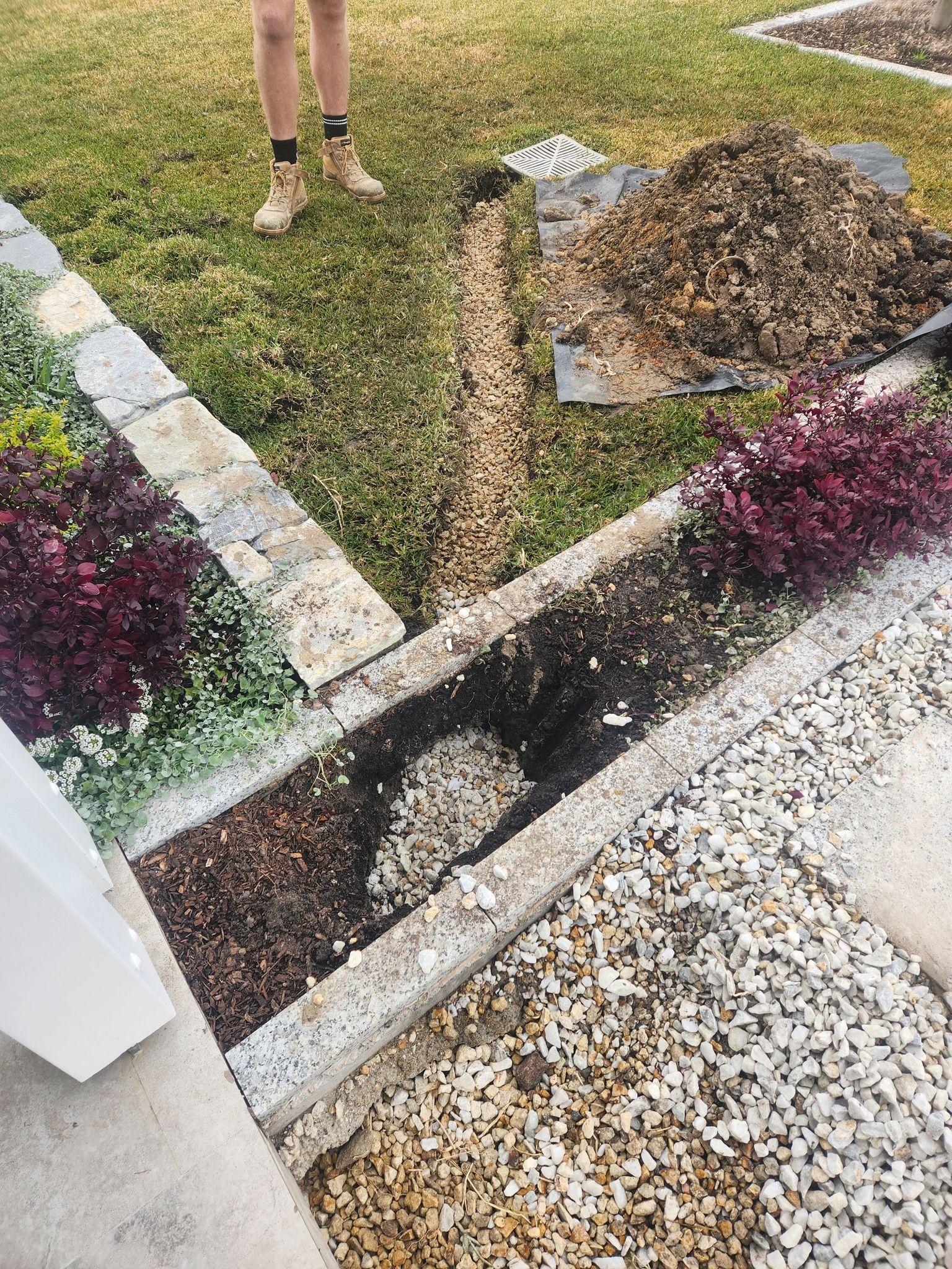 A Trench is Dug Along a Garden Bed — Total Perfection In Erina, NSW