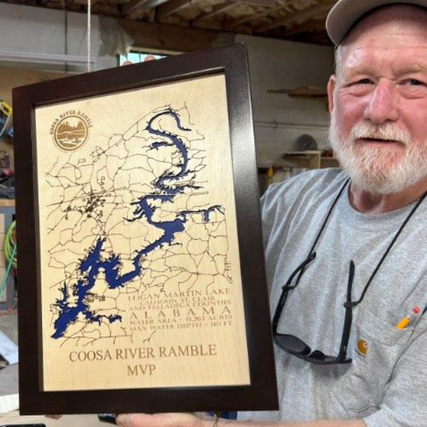 Man holding a framed “Coosa River Ramble MVP” plaque with a blue river map design