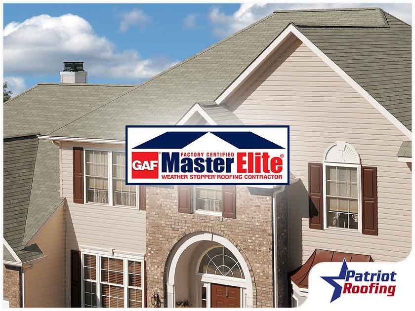 A house with a master elite logo on it