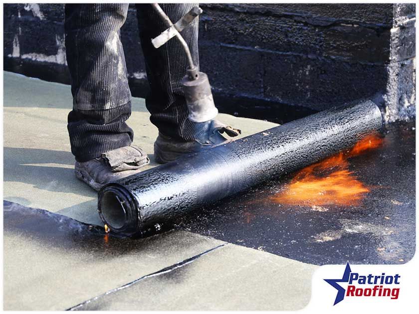 A patriot roofing logo can be seen in the corner of this photo