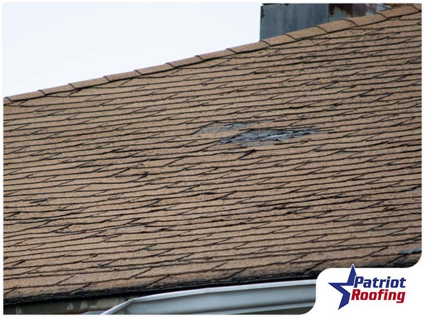 A close up of a roof with a hole in it.