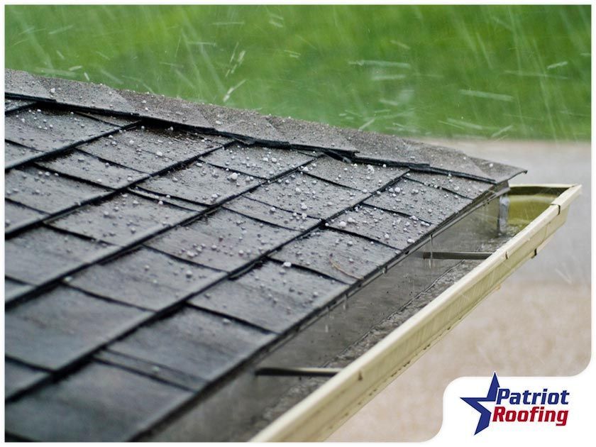 A picture of a roof with patriot roofing in the corner