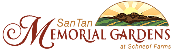 Logo for San Tan Memorial Gardens at Schnepf Farms, featuring text and a graphic of a sunrise over mountains and fields.