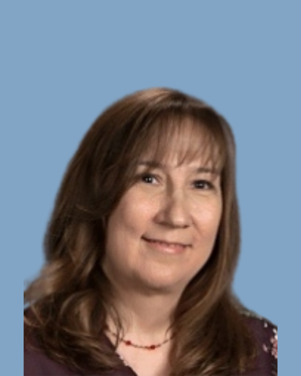 Smiling person with long dark hair in a black shirt against a teal background