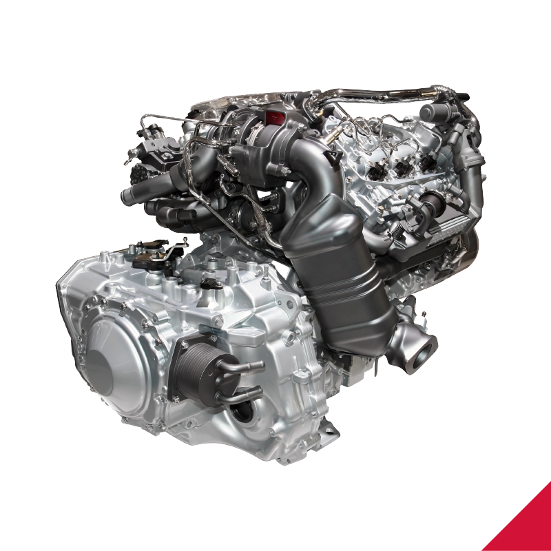 A close up of a car engine on a white background