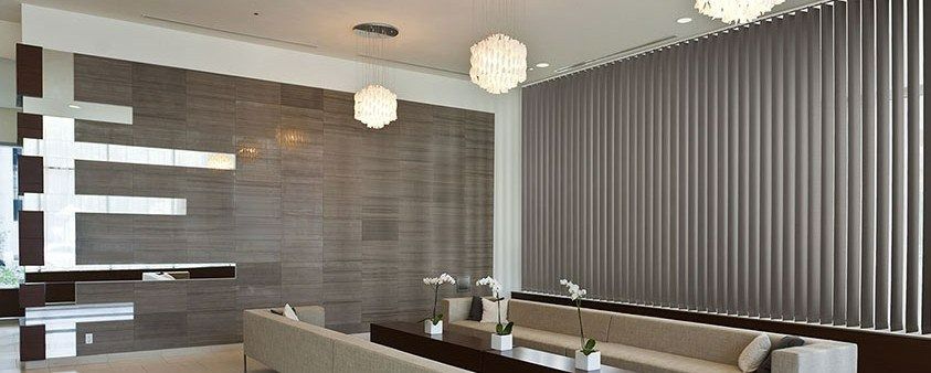 A Living Room With a Couch, Table, and Blinds — Simply Smarter Blinds in Corlette, NSW