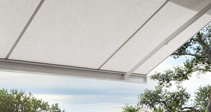 A White Awning With Trees in the Background — Simply Smarter Blinds in Corlette, NSW