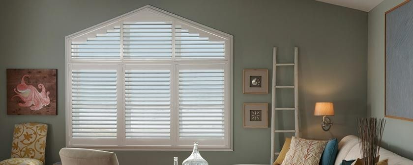 A Living Room With a Large Window With Shutters and a Ladder — Simply Smarter Blinds in Corlette, NSW