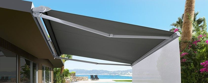 A Gray Awning is Sitting on the Side of a House — Simply Smarter Blinds in North Arm Cove, NSW
