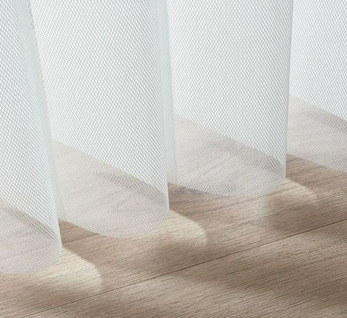 A Close Up of a White Curtain on a Wooden Floor — Simply Smarter Blinds in North Arm Cove, NSW