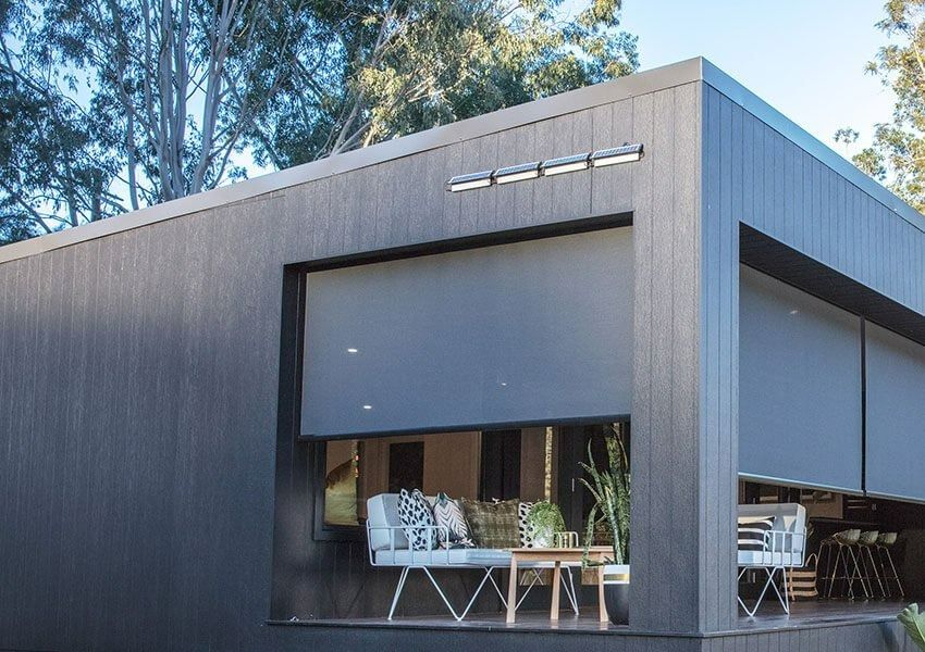A House With a Patio and a Couch and Chairs on It — Simply Smarter Blinds in Tea Gardens, NSW