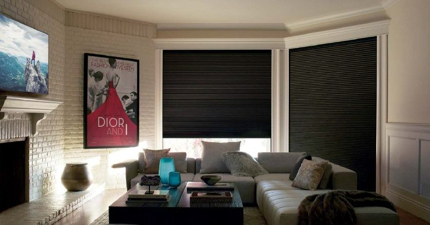 A Living Room With a Couch, Coffee Table, Fireplace and Television — Simply Smarter Blinds in Soldiers Point, NSW