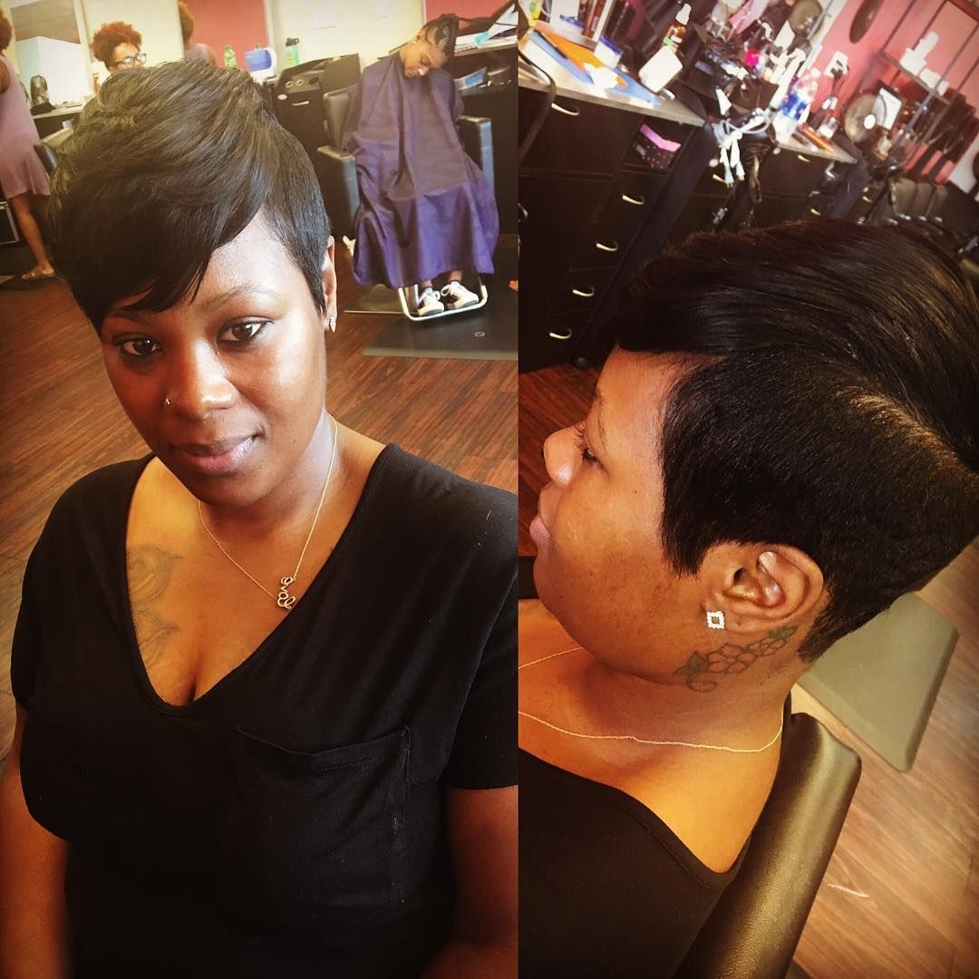 Woman with short black hair in a salon, showing front and side views of a styled haircut.