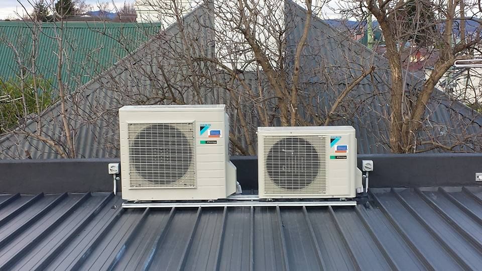 Two Air Conditioners Are Sitting on Top of A Roof- Hobart, TAS - The Heat Pump Man