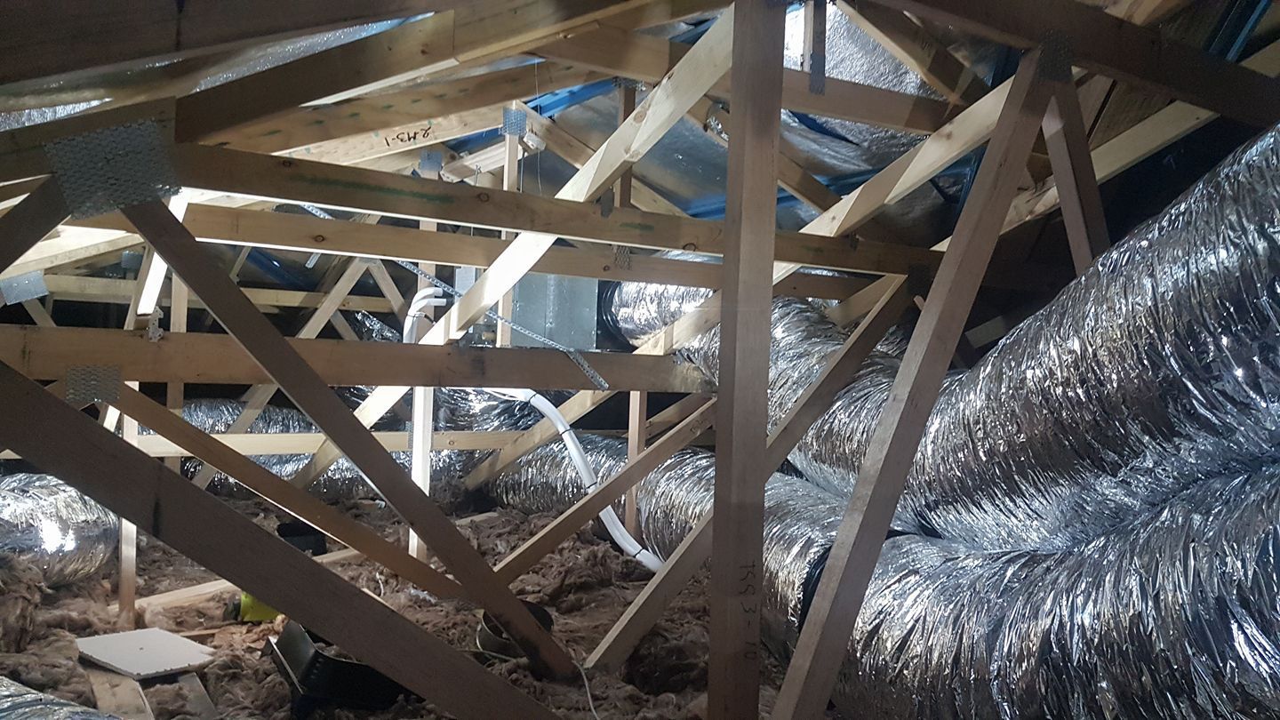 A Wooden Structure with A Lot of Pipes Coming out Of It- Hobart, TAS - The Heat Pump Man