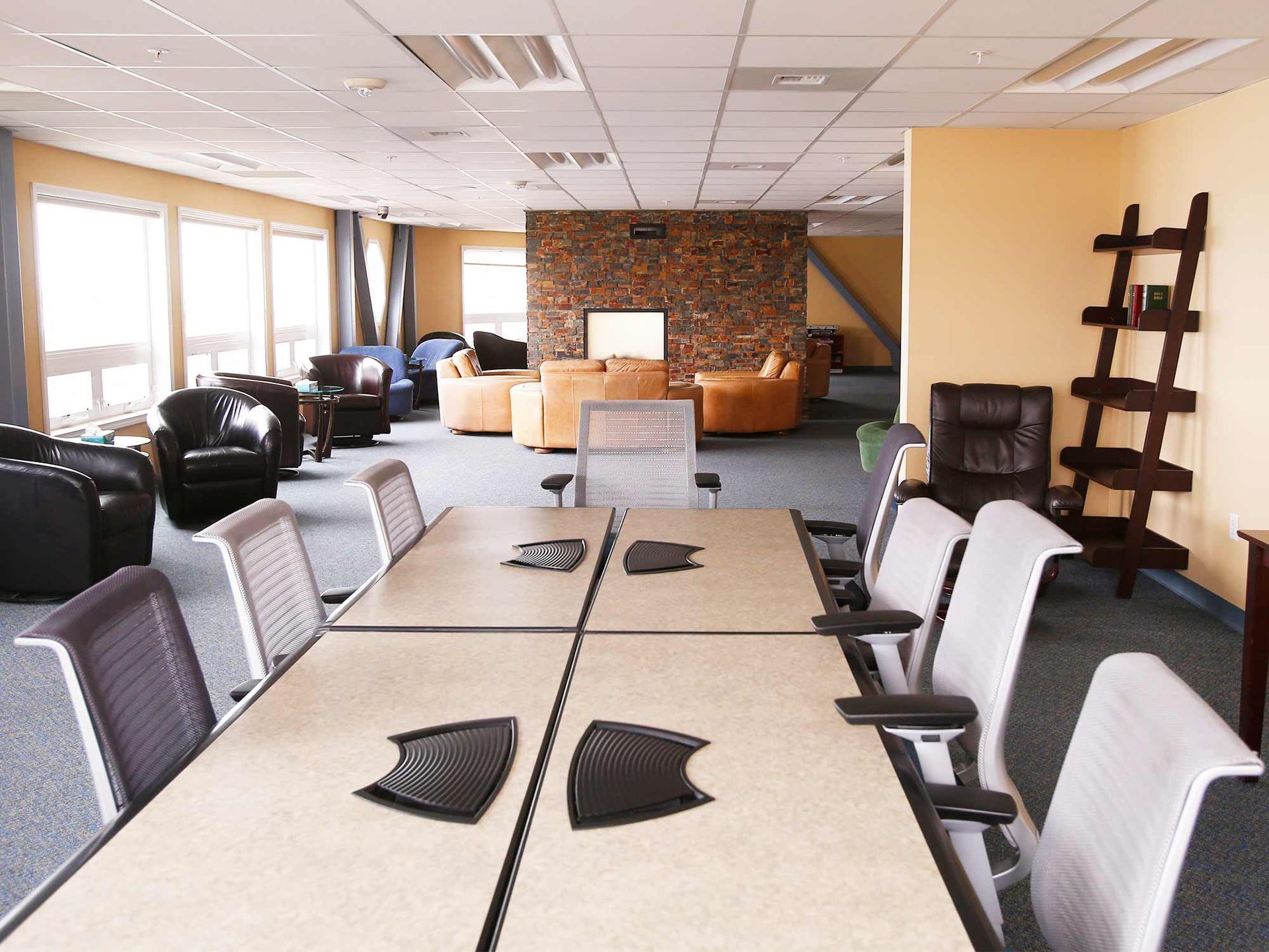 A conference room with a long table and chairs