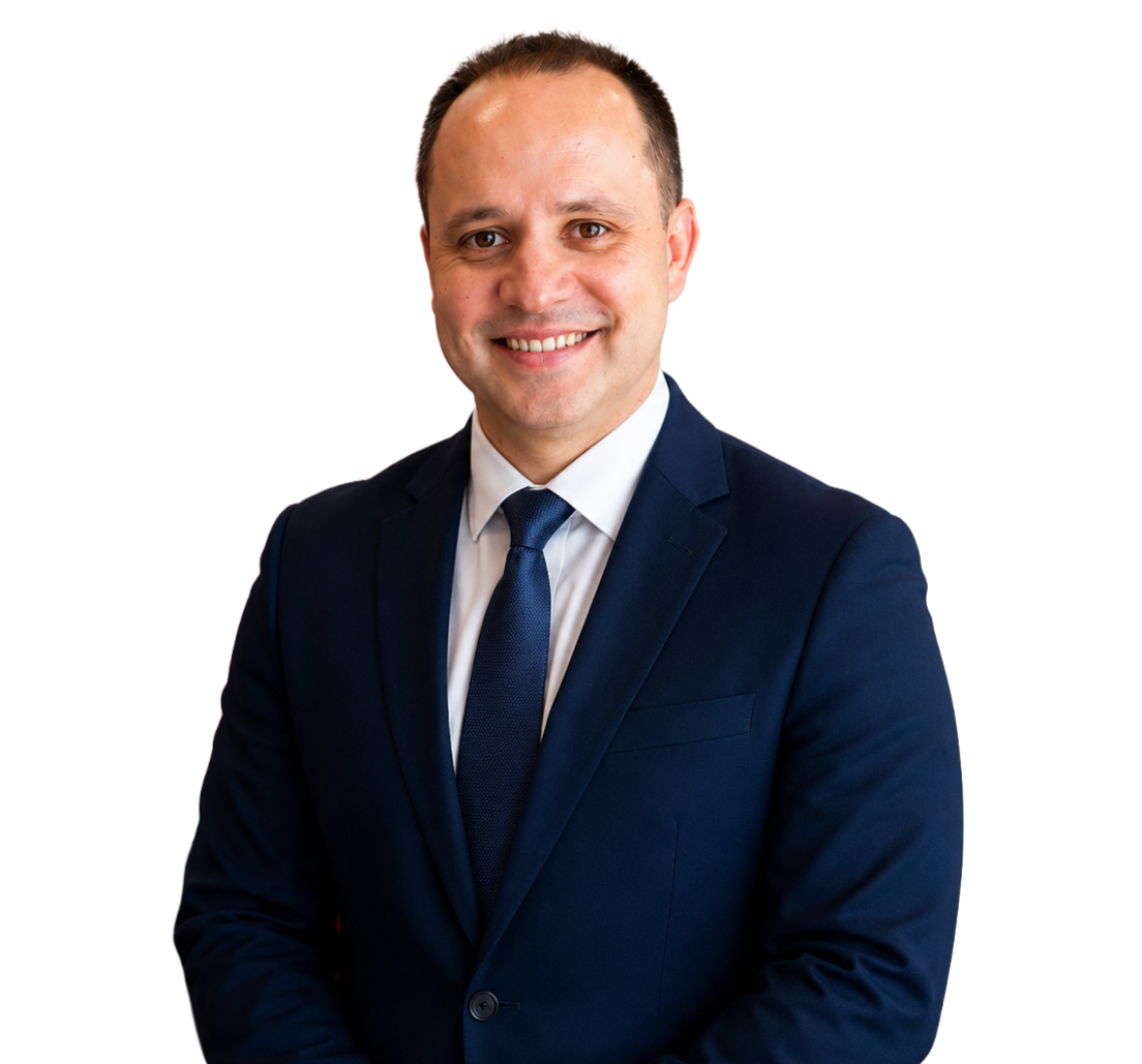 Portrait of Gerardo Martinez DC wearing a dark blue suite smiling