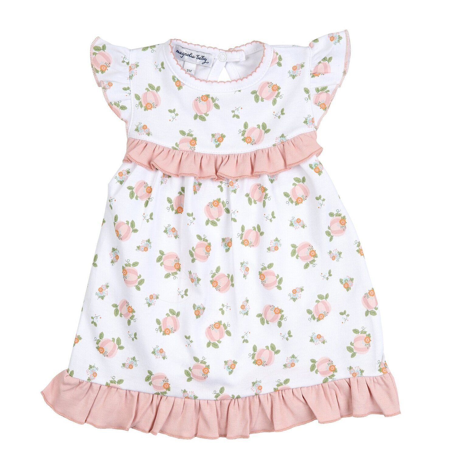 A white dress with pink ruffles and flowers on it