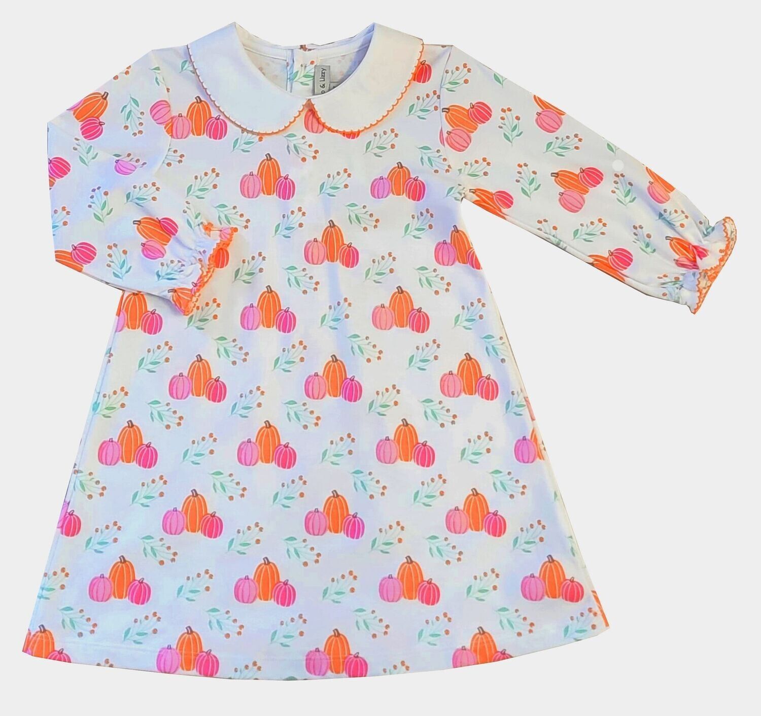 White dress with pumpkin print, a white collar, and long sleeves with orange trim.