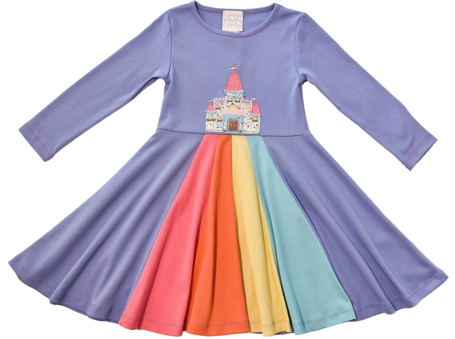 A purple dress with a castle on it and a rainbow skirt