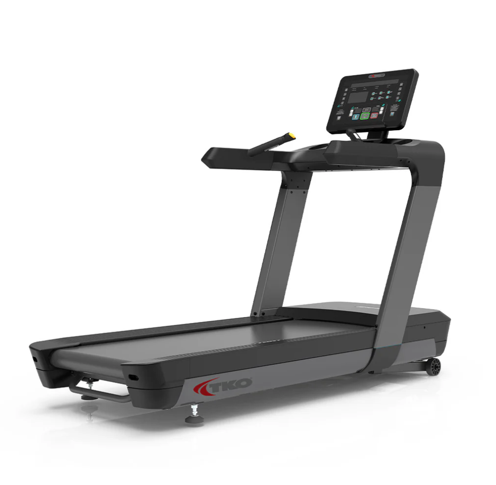 Black treadmill with console and handrails on a white background
