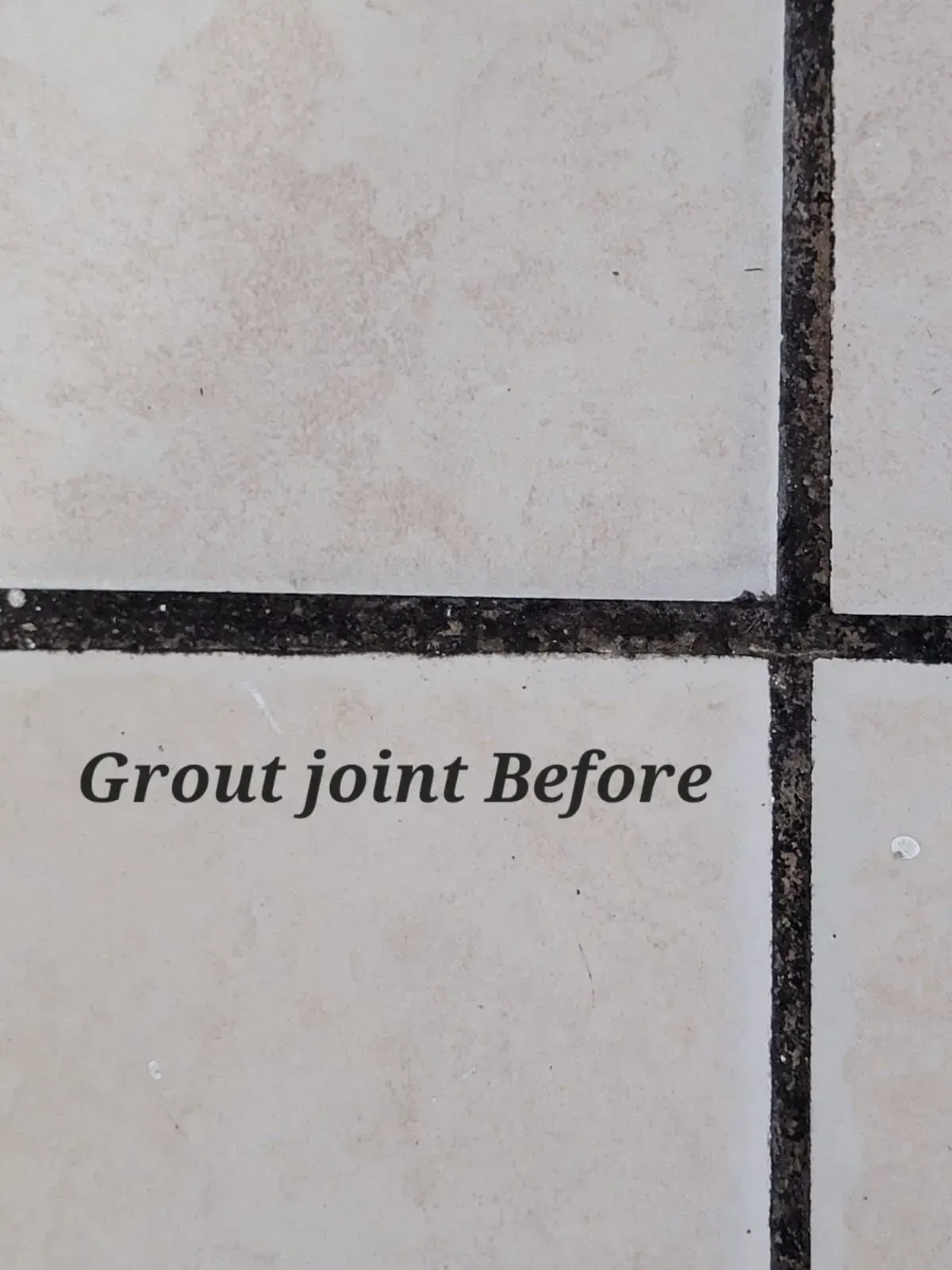 Close-up of tiled floor with dark grout lines and the text “Grout joint Before” printed below.