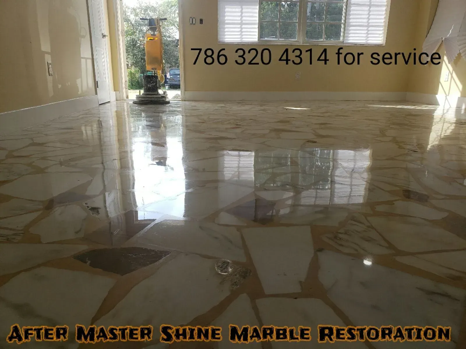Shiny marble floor in a bright room with a “786 320 4314 for service” sign.