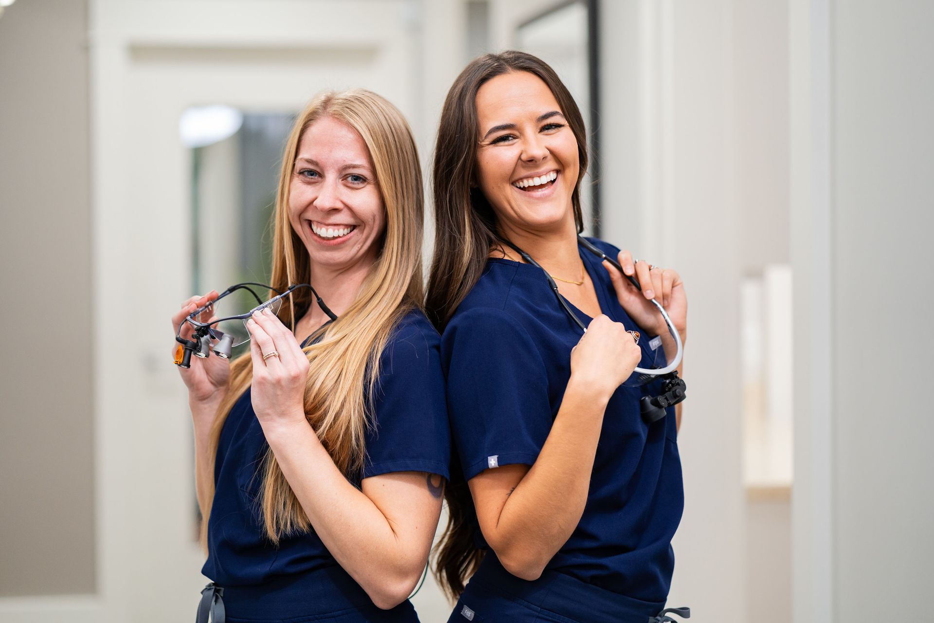 Our dental hygienists are smiling after assisting Dr. McMahon with oral surgery.