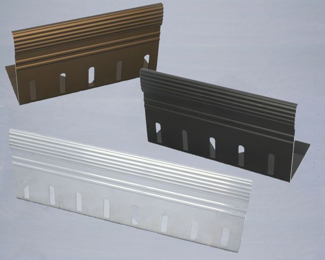 Three metal edging strips in bronze, black, and silver, each with a ridged top surface and slotted base.