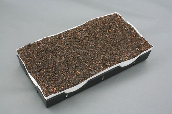 Rectangular box with dark brown textured material covering the top and white border.