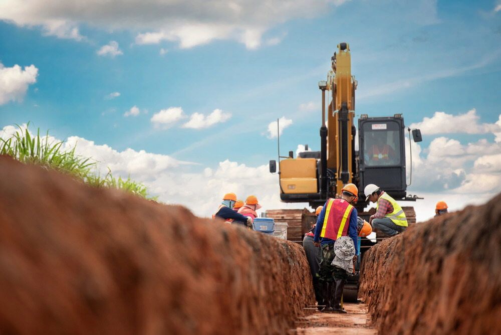 A Group of Construction Workers Are Working on a Pipeline — Simon Dickson Excavations in Moss Vale, NSW
