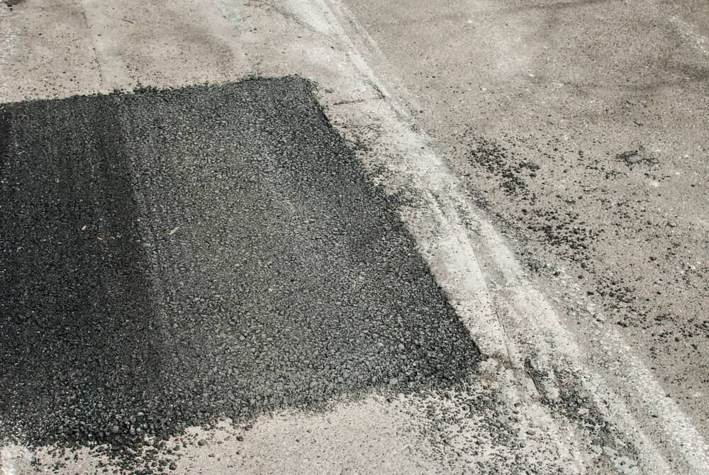 A Black and White Photo of a Patch of Asphalt on the Ground — Simon Dickson Excavations in Bundanoon, NSW
