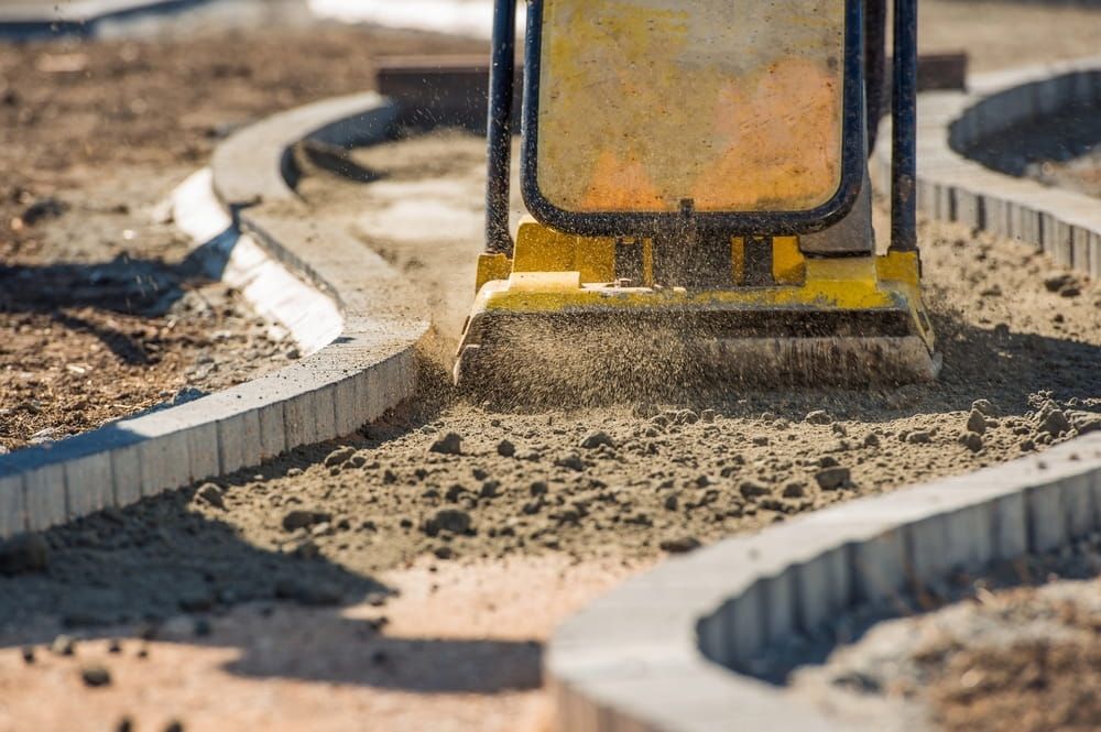 A Machine is Moving Concrete on a Construction Site — Simon Dickson Excavations in Goulburn, NSW