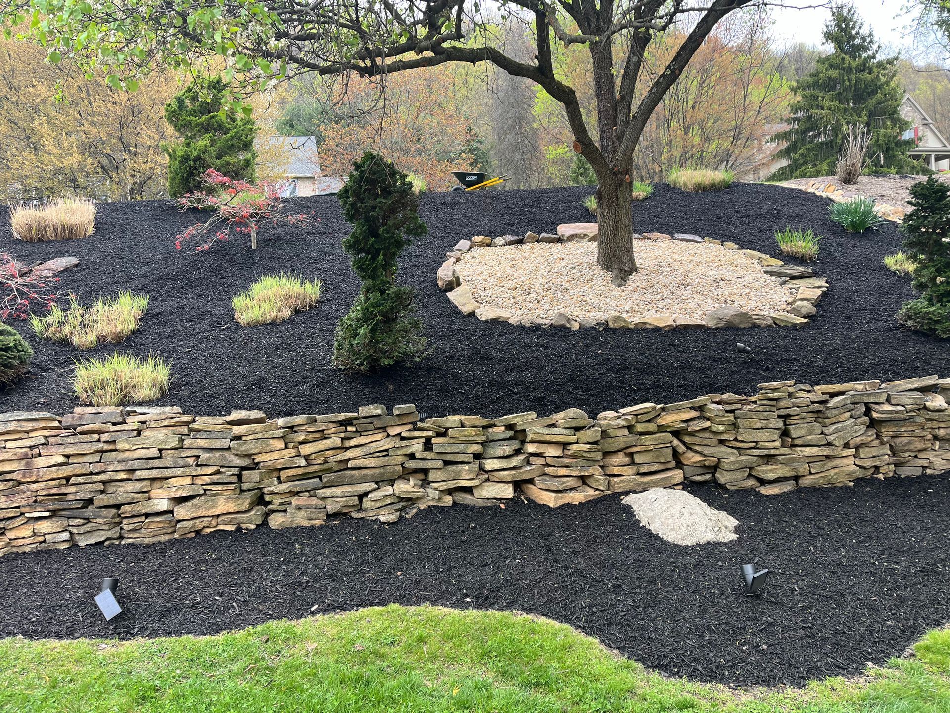 PRIMETIME Lawn Care landscape maintenance on a hill
