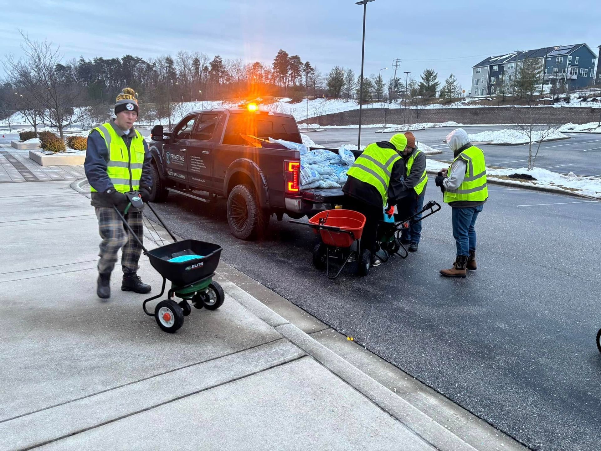 PRIMETIME lawn care and landscaping staff loading salt