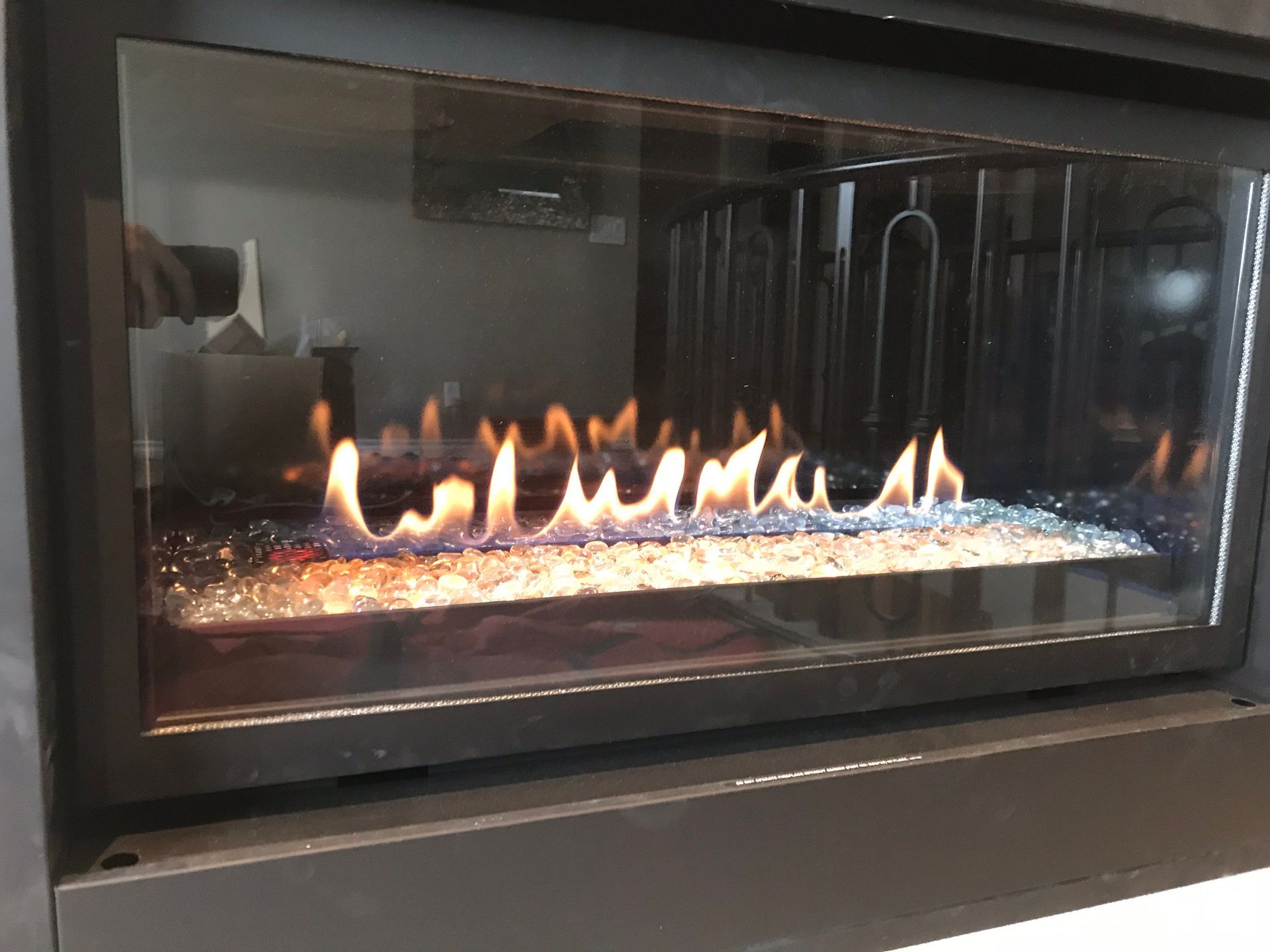 A fireplace with a lot of flames coming out of it