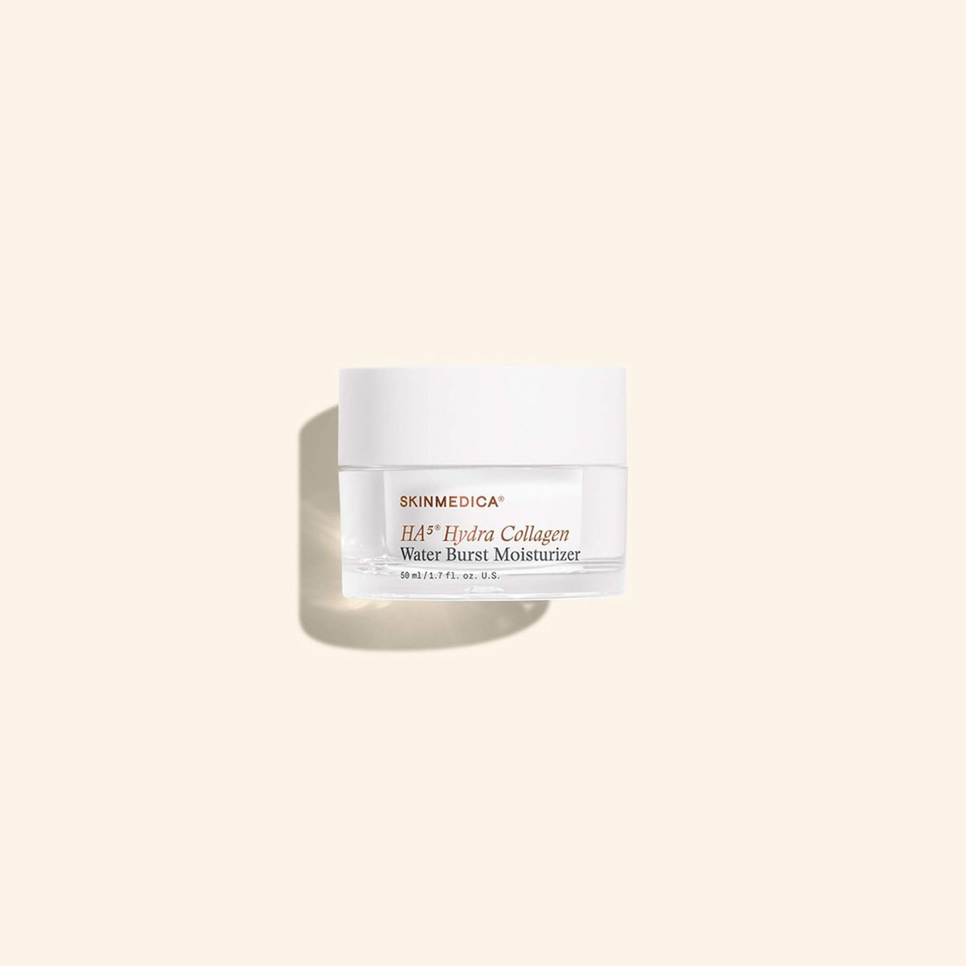 White skincare jar with beige label on a soft cream background
