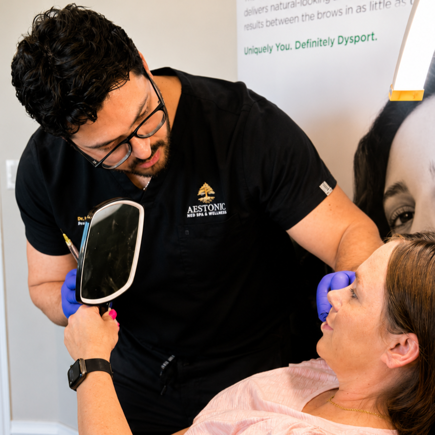 Nurse practitioner examining a patient in a bright clinic, holding a mirror to her face.