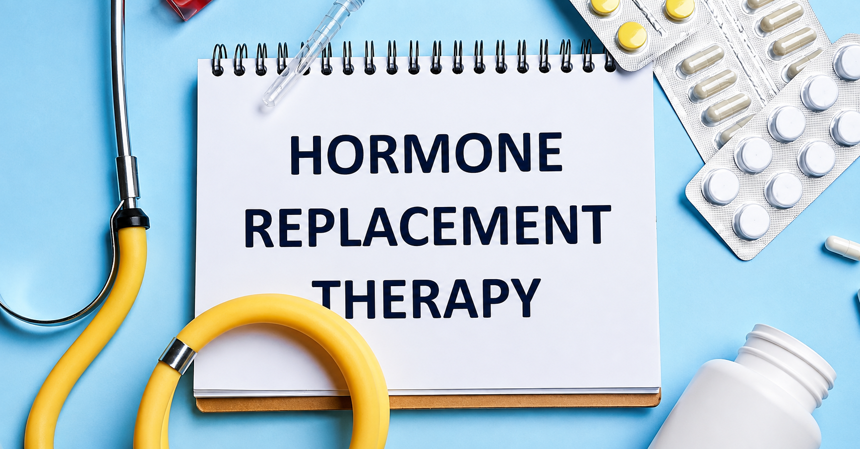 Hormone replacement therapy note with pills, stethoscope, syringe, and medical items on a blue background