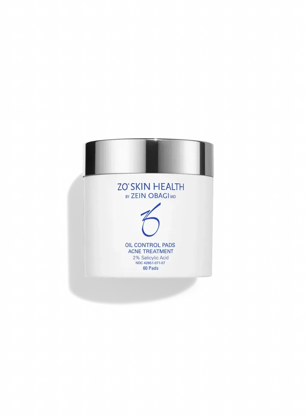 White skincare jar with silver lid and blue label on a plain background