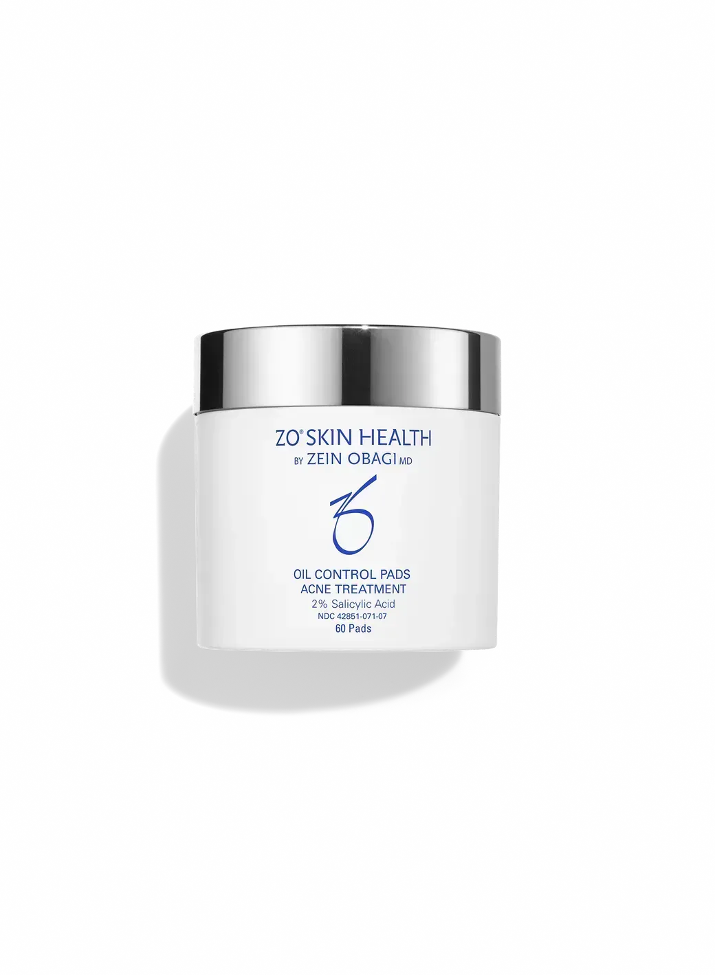 White skincare jar with silver lid on a plain white background.