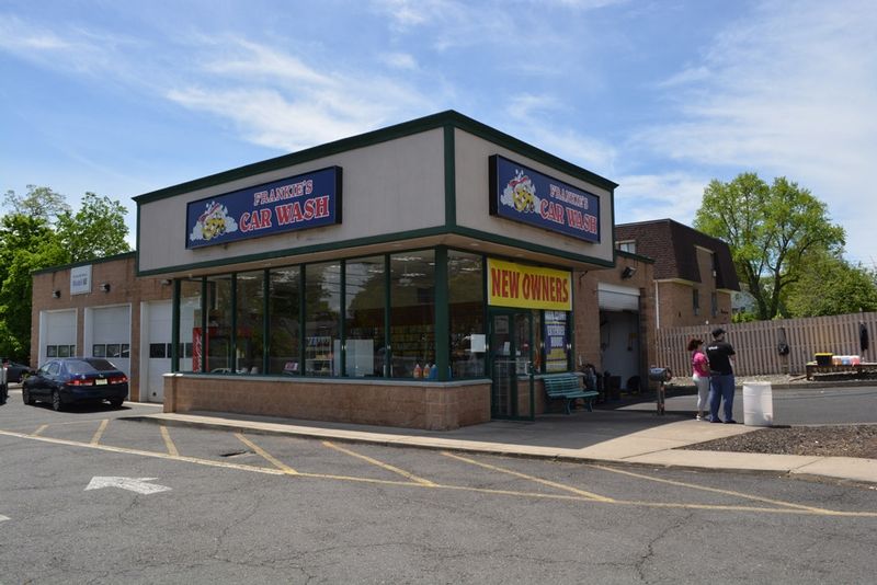A car wash is located on the corner of a street
