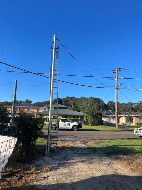 Roadside Scene with A Truck Carrying Equipment, a Small Trailer — SRB Electrical Contracting Pty Ltd In Davistown, NSW